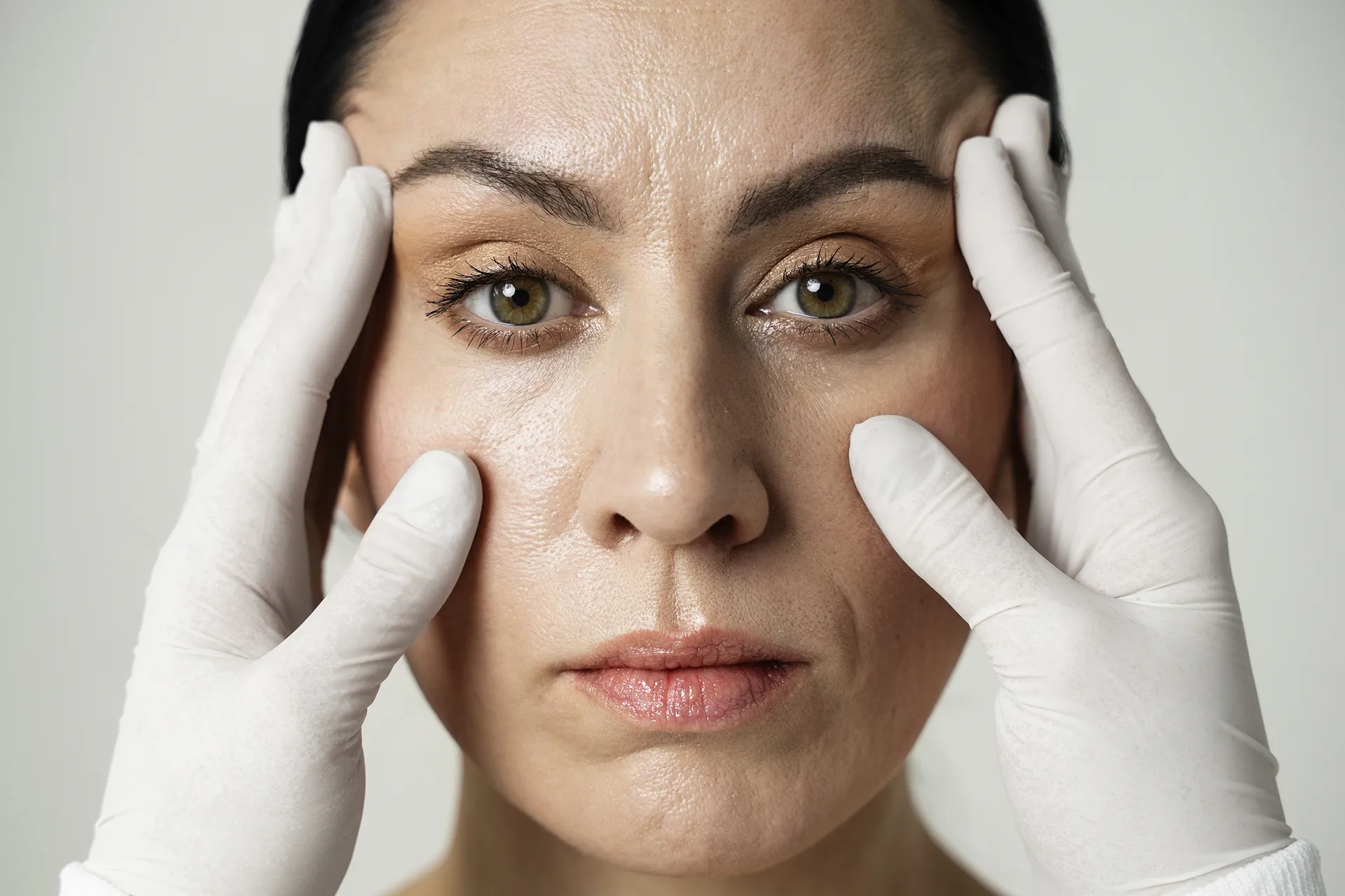 front-view-hands-with-gloves-touching-woman-s-face copy