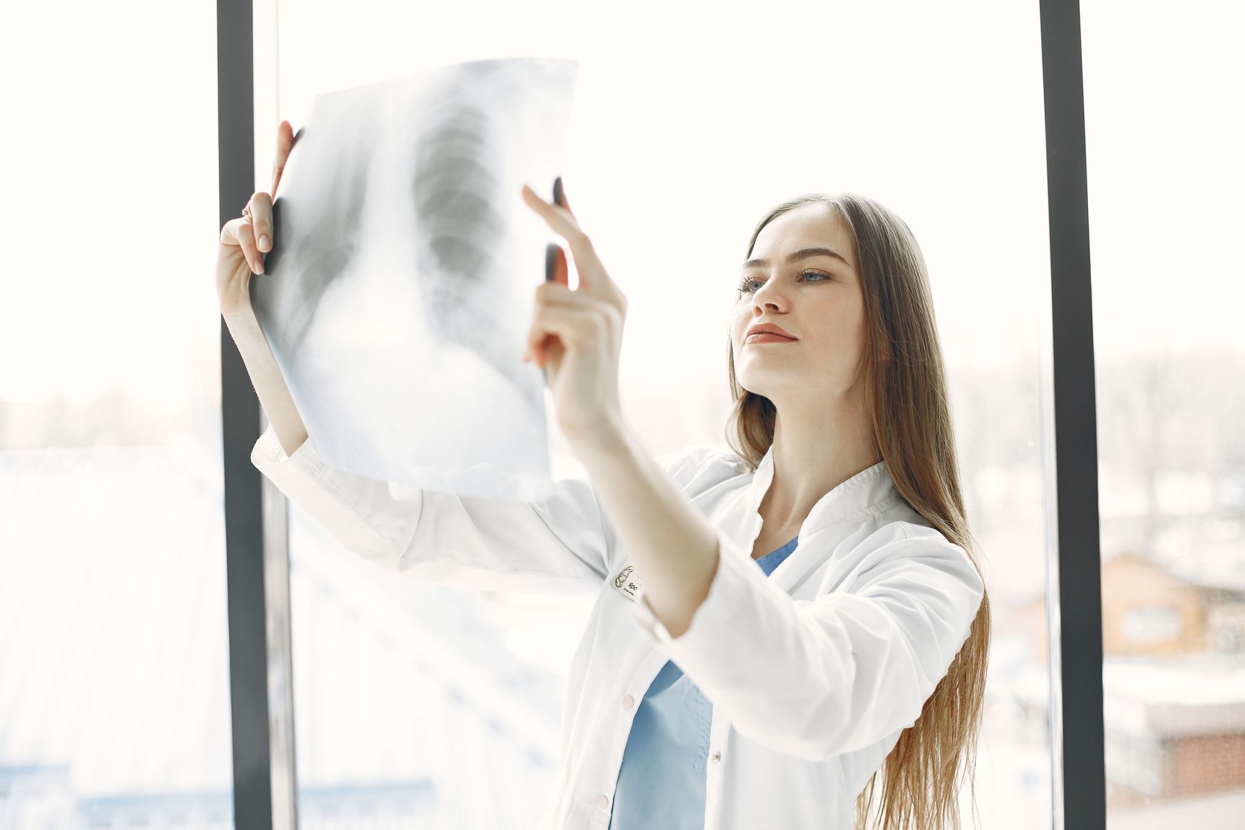 x-ray-window-woman-with-long-hair-doctor-work-clothes
